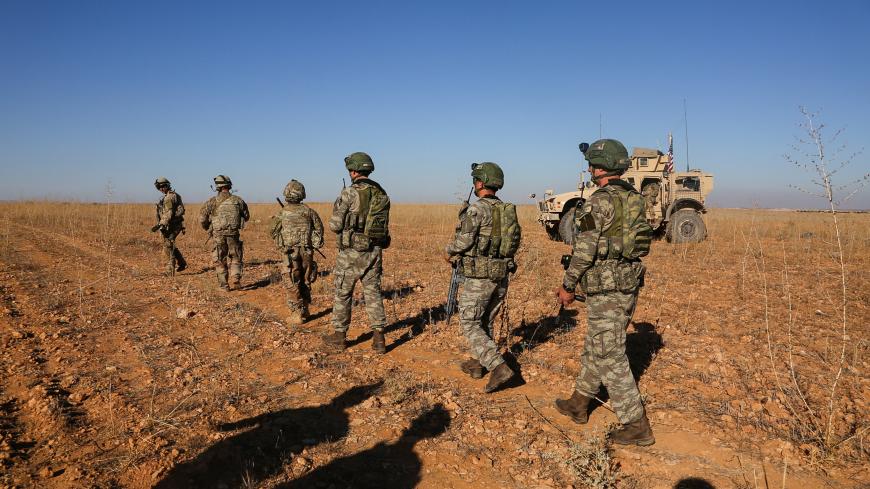U.S. and Turkish soldiers conduct the first-ever combined joint patrol outside Manbij, Syria, November 1, 2018. Picture taken November 1, 2018. Courtesy Arnada Jones/U.S. Army/Handout via REUTERS  ATTENTION EDITORS - THIS IMAGE HAS BEEN SUPPLIED BY A THIRD PARTY. - RC17C4EA11D0