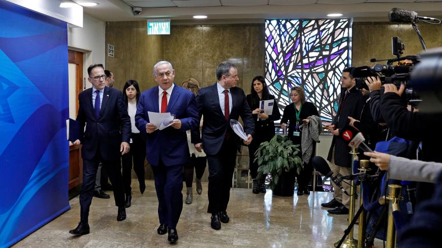 Israeli Prime Minister Benjamin Netanyahu greets journalists as he arrives to the weekly cabinet meeting at his Jerusalem office  on January 6, 2019. (Photo by GALI TIBBON / various sources / AFP)        (Photo credit should read GALI TIBBON/AFP/Getty Images)
