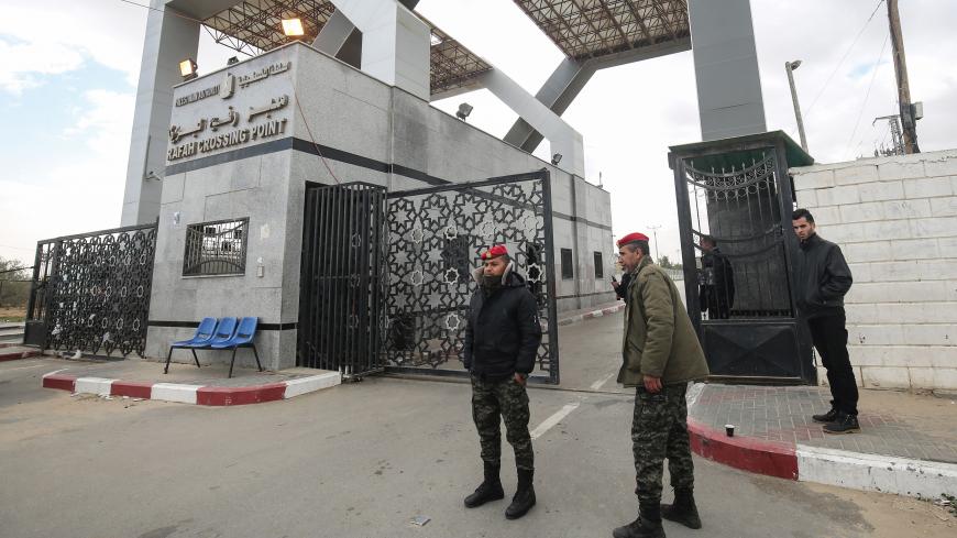 Palestinian security forces loyal to Hamas stand guard at the Rafah border crossing with Egypt, in the southern Gaza Strip, on January 8, 2019. - The Egyptian border crossing was closed for Palestinians seeking to leave Gaza on Tuesday, a border official said, as infighting between Palestinian factions increases. (Photo by SAID KHATIB / AFP)        (Photo credit should read SAID KHATIB/AFP/Getty Images)