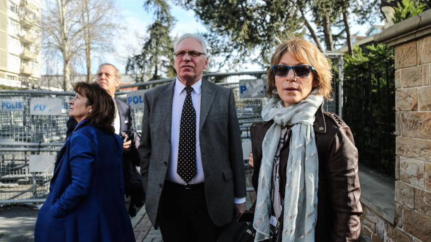 Agnes Callamard (R), UN special rapporteur on extra-judicial, summary or arbitrary executions, stands behind barriers in front of of the Saudi Consulate, in Istanbul, on January 29, 2019 during her visit as part of an inquiry into the murder of Saudi journalist Jamal Khashoggi, who was reportedly killed inside the Saudi Consulate on October 2018. (Photo by Cemal YURTTAS / AFP) / Turkey OUT        (Photo credit should read CEMAL YURTTAS/AFP/Getty Images)