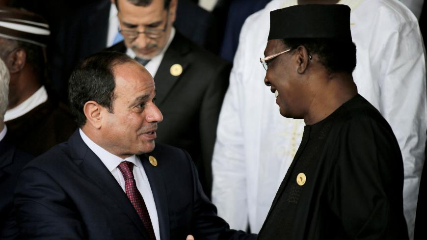 Egypt's President Abdel-Fattah el-Sisi talks to Chad's president Idriss Deby at the 30th Ordinary Session of the Assembly of the Heads of State and the Government of the African Union in Addis Ababa, Ethiopia January 28, 2018. REUTERS/Tiksa Negeri - RC1BB8D8BD20