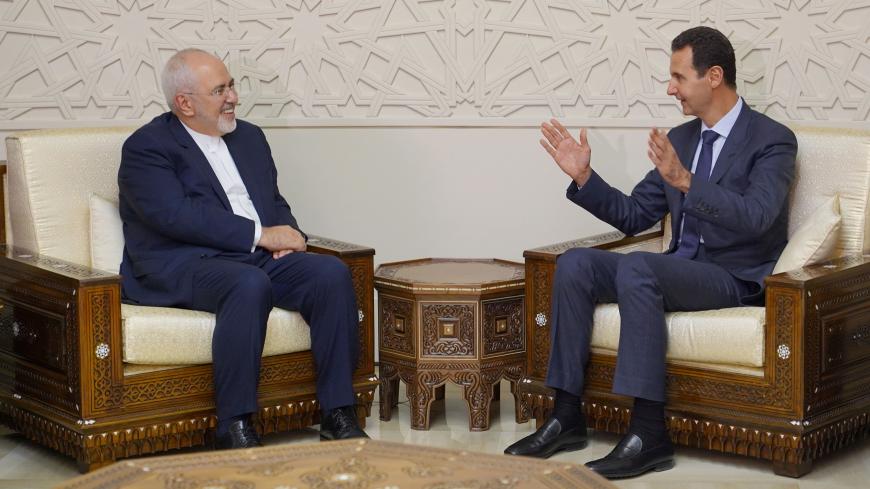 Syrian President Bashar al-Assad meets with Iran's Foreign Minister Mohammad Javad Zarif in Damascus, Syria September 3, 2018. SANA/Handout via REUTERS     ATTENTION EDITORS - THIS IMAGE WAS PROVIDED BY A THIRD PARTY. REUTERS IS UNABLE TO INDEPENDENTLY VERIFY THIS IMAGE. - RC1F08842BC0