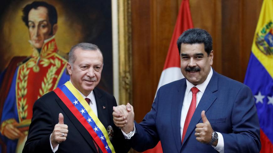 Turkish President Tayyip Erdogan and Venezuela's President Nicolas Maduro attend an agreement-signing ceremony between Turkey and Venezuela at Miraflores Palace in Caracas, Venezuela December 3, 2018. REUTERS/Manaure Quintero - RC1A1B7C8000