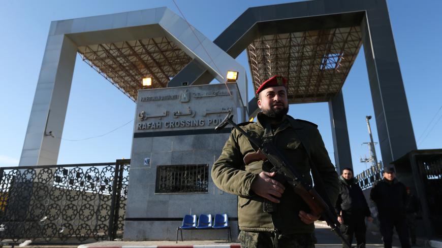 A member of Palestinian security forces loyal to Hamas stands guard at the gate of Rafah border crossing, in the southern Gaza Strip January 7, 2019. REUTERS/Ibraheem Abu Mustafa - RC16B100DC80