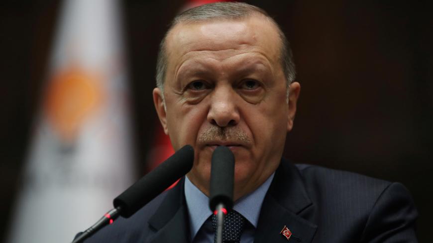 Turkish President Tayyip Erdogan addresses members of parliament from his ruling AK Party (AKP) during a meeting at the Turkish parliament in Ankara, Turkey, January 8, 2019. REUTERS/Umit Bektas - RC11DD776AB0