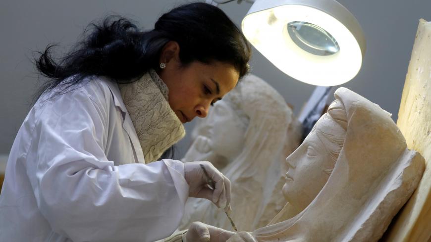 A specialist works on a damaged statue from Palmyra at Syria's National Museum of Damascus, Syria January 9, 2019. Picture taken January 9, 2019. REUTERS/Omar Sanadiki - RC18E2895C50