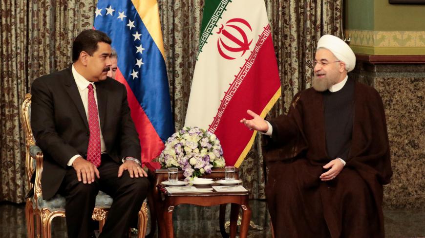 Iran's President Hassan Rouhani (R) meets with Venezuela's President Nicolas Maduro in Tehran, Iran October 22, 2016. Miraflores Palace/Handout via REUTERS ATTENTION EDITORS - THIS PICTURE WAS PROVIDED BY A THIRD PARTY. EDITORIAL USE ONLY. - S1AEUIMBOZAA