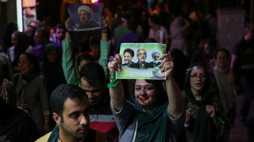 Supporters of Iranian president Hassan Rouhani celebrate his victory in the presidential election in Tehran, Iran, May 20, 2017. TIMA via REUTERS ATTENTION EDITORS - THIS IMAGE WAS PROVIDED BY A THIRD PARTY. FOR EDITORIAL USE ONLY.      TPX IMAGES OF THE DAY - RC1B70C1D340