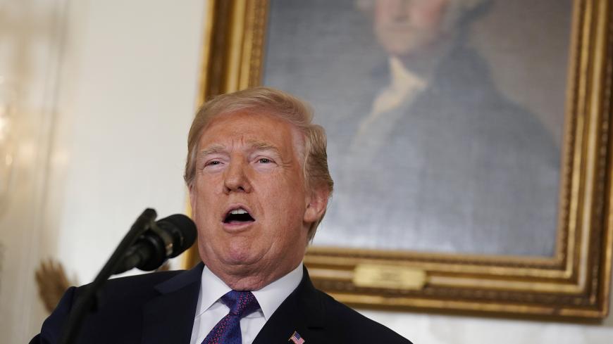 U.S. President Donald Trump announces missile strikes on Syria while delivering a statement in front of portrait of President George Washington at the White House in Washington, U.S., April 13, 2018. REUTERS/Yuri Gripas - HP1EE4E04JFDA