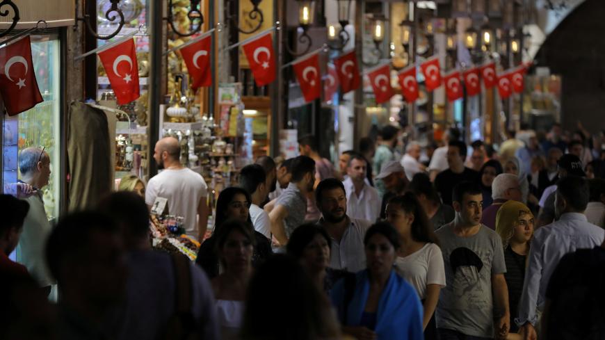 People shop in an old bazaar in Istanbul, Turkey, June 14, 2018. REUTERS/Huseyin Aldemir - RC16883D3170