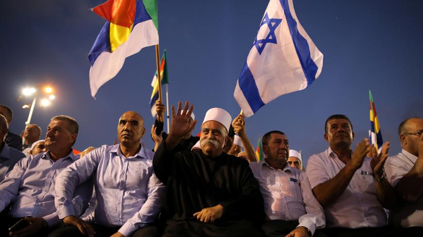 Leaders from the Druze minority together with others take part in a rally to protest against Jewish nation-state law in Rabin square in Tel Aviv, Israel August 4, 2018. REUTERS/Corinna Kern - RC16FCA50CB0