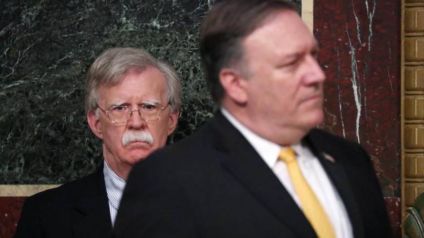 U.S. National Security Advisor John Bolton and Secretary of State Mike Pompeo attend the Interagency Task Force to Monitor and Combat Trafficking in Persons annual meeting at the White House in Washington, U.S., October 11, 2018. REUTERS/Jonathan Ernst - RC112D918F90