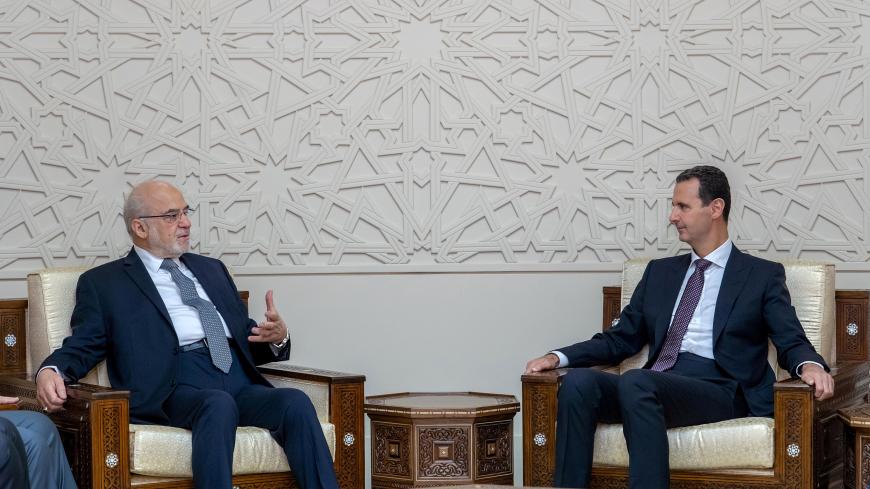 Syrian President Bashar al-Assad meets with Iraqi Foreign Minister Ibrahim al-Jaafari in Damascus, Syria October 15, 2018. SANA/Handout via REUTERS     ATTENTION EDITORS - THIS IMAGE WAS PROVIDED BY A THIRD PARTY. REUTERS IS UNABLE TO INDEPENDENTLY VERIFY THIS IMAGE - RC135195E970