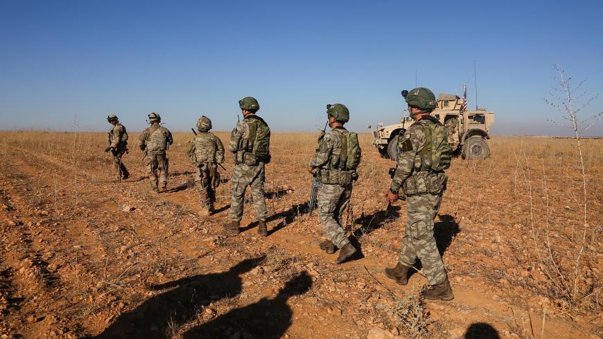 U.S. and Turkish soldiers conduct the first-ever combined joint patrol outside Manbij, Syria, November 1, 2018. Picture taken November 1, 2018. Courtesy Arnada Jones/U.S. Army/Handout via REUTERS  ATTENTION EDITORS - THIS IMAGE HAS BEEN SUPPLIED BY A THIRD PARTY. - RC17C4EA11D0