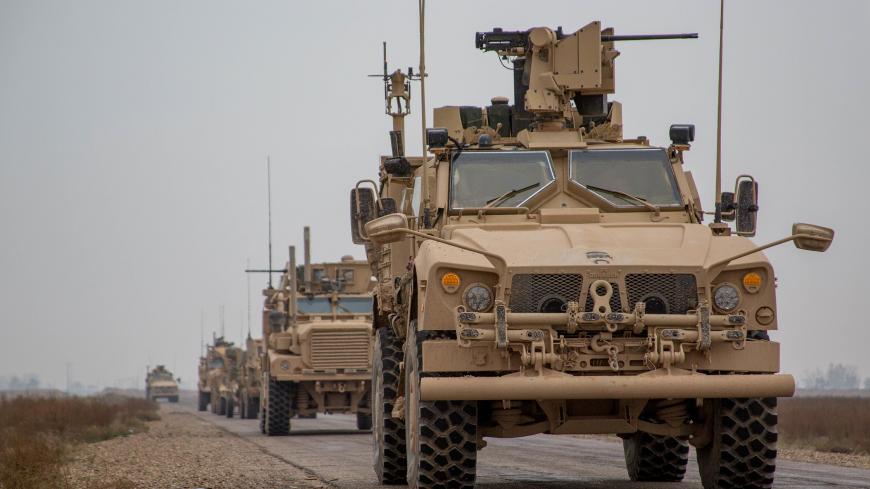 A Coalition convoy of U.S. led international coalition against the Islamic State of Iraq and the Levant (ISIL) stops to test fire their M2 machine guns and MK19 grenade launcher in the Middle Euphrates River Valley in the Deir ez-Zor province, Syria, November 22, 2018. Picture taken November 22, 2018. Courtesy Matthew Crane/U.S. Army/Handout via REUTERS ATTENTION EDITORS - THIS IMAGE HAS BEEN SUPPLIED BY A THIRD PARTY. - RC168AA782C0