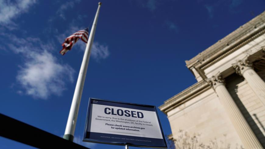 A sign declares the National Archive is closed due to a partial federal government shutdown in Washington, U.S., December 22, 2018.      REUTERS/Joshua Roberts - RC1AE6EAC290