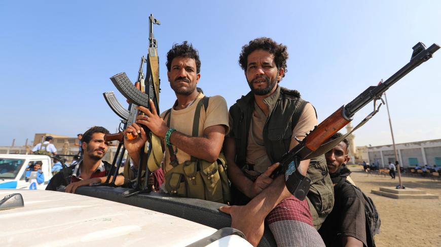 Houthi militants ride on the back of a truck as they withdraw, as part of a U.N.-sponsored peace agreement signed in Sweden earlier this month, from the Red Sea city of Hodeidah, Yemen December 29, 2018. REUTERS/Abduljabbar Zeyad - RC1B59795B50