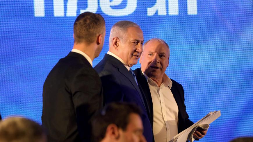 Israeli Prime Minister Benjamin Netanyahu (C) attends a Likud Party gathering marking the first day of the eight-day Jewish holiday of Hanukkah, in Ramat Gan, Israel December 2, 2018. REUTERS/Corinna Kern - RC1B99A9AC70