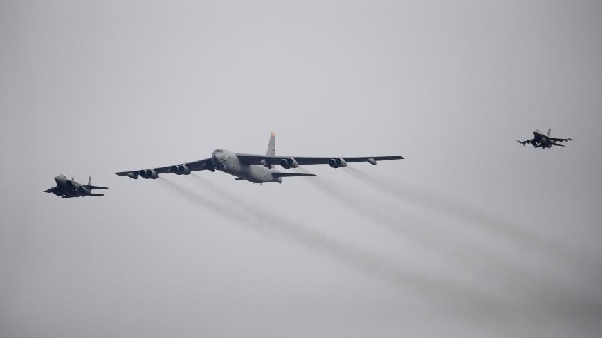 A U.S. Air Force B-52 (C) flies over Osan Air Base in Pyeongtaek, South Korea, January 10, 2016. REUTERS/Kim Hong-Ji - GF20000089868