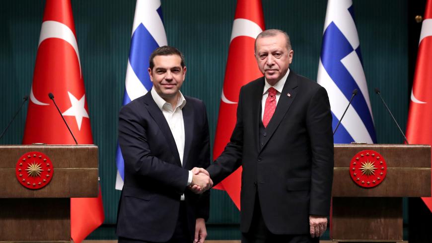 Turkish President Tayyip Erdogan and Greek Prime Minister Alexis Tsipras shake hands after holding a joint news conference in Ankara, Turkey February 5, 2019. REUTERS/Umit Bektas - RC1ABCF85EB0