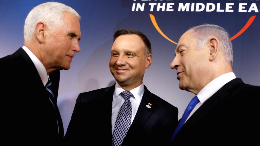 U.S. Vice President Mike Pence, Polish President Andrzej Duda and Israeli Prime Minister Benjamin Netanyahu talk during the family photo at the Middle East conference at the Royal Castle in Warsaw, Poland, February 13, 2019. REUTERS/Kacper Pempel - RC18F180B8B0