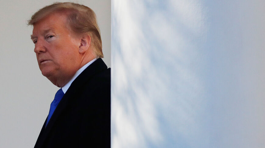 U.S. President Donald Trump heads back to the Oval Office after declaring a national emergency at the U.S.-Mexico border during remarks about border security in the Rose Garden of the White House in Washington, U.S., February 15, 2019. REUTERS/Carlos Barria - RC17F0AE0D30