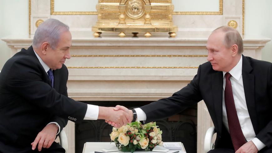 Russian President Vladimir Putin (R) shakes hands with Israeli Prime Minister Benjamin Netanyahu during a meeting at the Kremlin in Moscow, Russia February 27, 2019. REUTERS/Maxim Shemetov - RC19AC167970