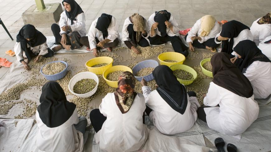 Workers sort pistachios by hand during a final inspection before packing at a processing factory in Rafsanjan, 1,000 kilometers southeast of Tehran September 23, 2008. Iran may this year see its position as the world's largest producer of pistachio nuts overtaken by the United States, as the Islamic Republic suffers one of its worst harvests ever. Picture taken September 23, 2008. To match feature IRAN-PISTACHIOS/       REUTERS/Caren Firouz  (IRAN) - GM1E4A90KNL01