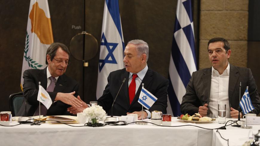 Israeli Prime Minister Benjamin Netanyahu (C) shakes hands with with Cypriot President Nicos Anastasiades (L) as  Greek Prime Minister Alexis Tsipras looks on during their meeting in Jerusalem on March 20, 2019. -  (Photo by GALI TIBBON / AFP)        (Photo credit should read GALI TIBBON/AFP/Getty Images)