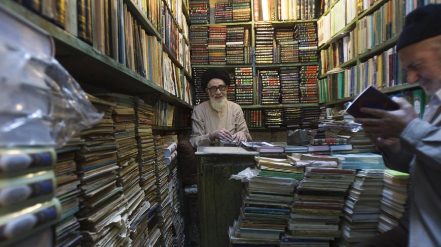 EDITORS' NOTE: Reuters and other foreign media are subject to Iranian restrictions on their ability to film or take pictures in Tehran

A clergyman sits at his bookshop in Tabriz historic market, 633 km (393 miles) northwest of Tehran, early morning August 28, 2011. The Tabriz market was located along the Silk Road trade route and comprised of interlinked structures and spaces for various commercial, religious and educational uses. This market has been registered as a UNESCO heritage site on July 31, accord