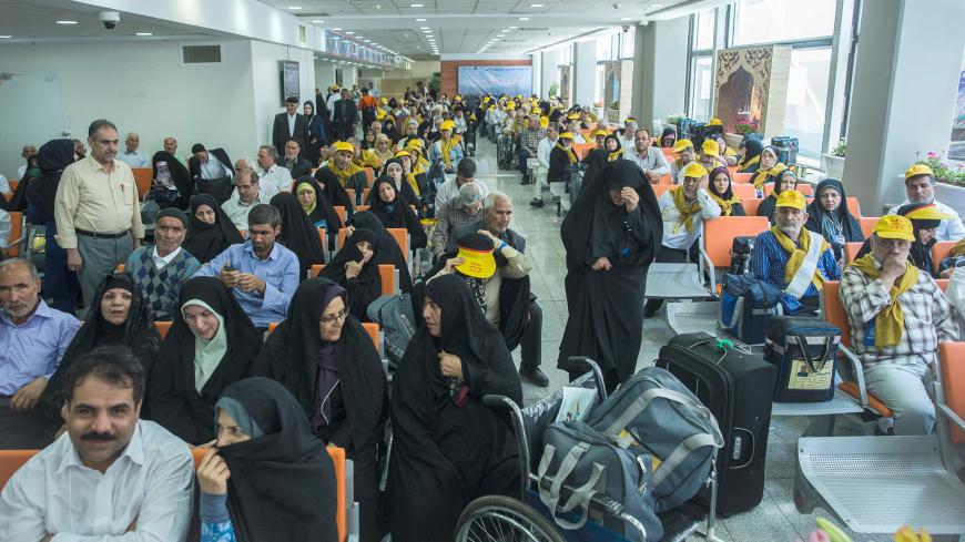 Iranian pilgrims wait at the Imam Khomeini airport in Tehran as they depart for the annual haj pilgrimage to the holy city of Mecca, in Tehran, Iran, July 31, 2017. Nazanin Tabatabaee Yazdi / TIMA via REUTERS. ATTENTION EDITORS – THIS IMAGE HAS BEEN SUPPLIED BY A THIRD PARTY. - RC1CBB5CCCA0