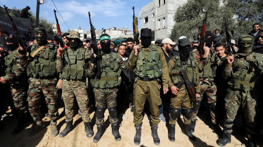 Palestinian Hamas militants take part in the funeral of their comrade Mahmoud Al-Nabaheen in the central Gaza Strip January 23, 2019. REUTERS/Ibraheem Abu Mustafa - RC1E6E9AAB00