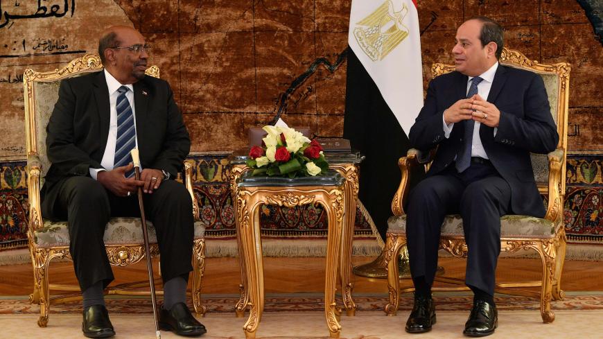 Egyptian President Abdel Fattah al-Sisi meets with Sudan's President Omar Hassan al-Bashir at the Ittihadiya presidential palace in Cairo, Egypt, January 27, 2019. in this handout picture courtesy of the Egyptian Presidency. The Egyptian Presidency/Handout via REUTERS ATTENTION EDITORS - THIS IMAGE WAS PROVIDED BY A THIRD PARTY - RC112CAE5470
