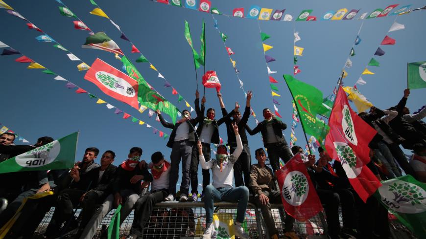 People wave pro-Kurdish Peoples' Democratic Party (HDP) flags during a gathering to celebrate Newroz, which marks the arrival of spring and the new year, in Diyarbakir, Turkey, March 21, 2019. REUTERS/Sertac Kayar - RC18FB2D9600