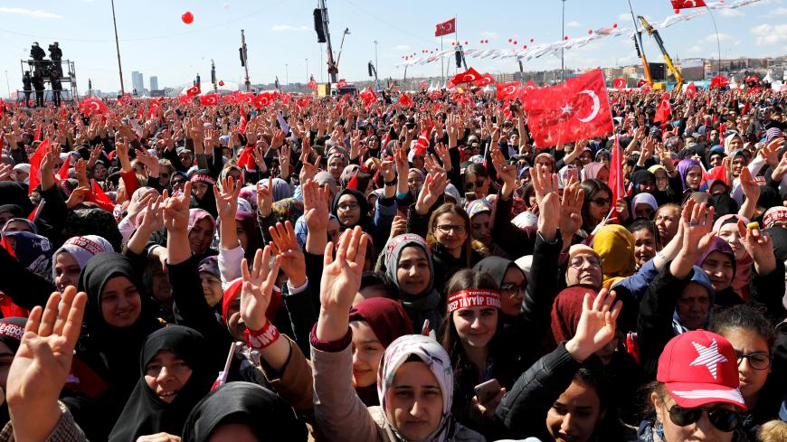 Supporters of Turkish President Tayyip Erdogan gather ahead of a rally for the upcoming local elections, in Istanbul, Turkey March 24, 2019. REUTERS/Umit Bektas - RC1436F31AD0