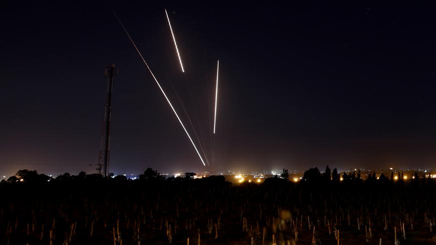 Streaks of light are pictured as rockets are launched from the  Gaza Strip towards Israel, as seen from the Israeli side of the border March 25, 2019 REUTERS/Amir Cohen - RC1BAFEB0A50