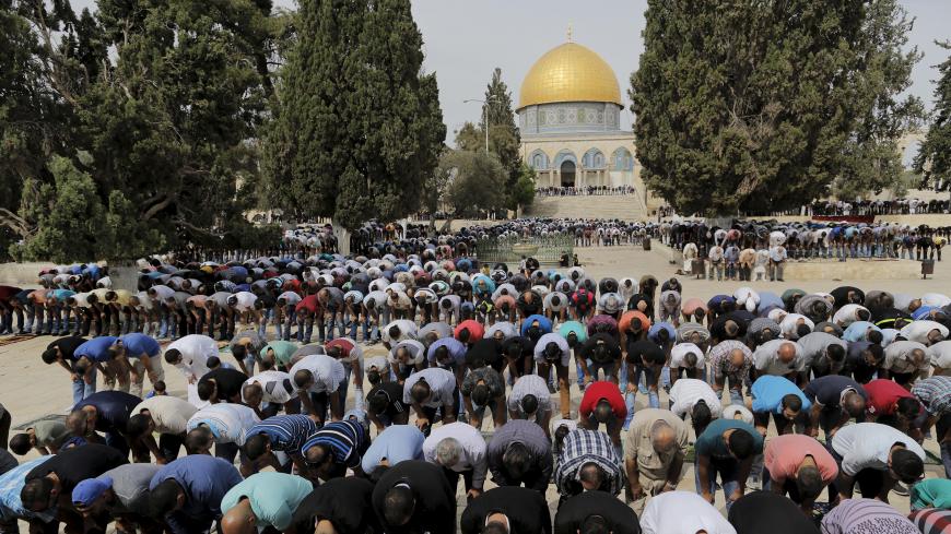 The Dome of the Rock is seen in the background as Palestinian men take part in Friday prayers on the compound known to Muslims as Noble Sanctuary and to Jews as Temple Mount in Jerusalem's Old City October 23, 2015. Palestinian factions called for mass rallies against Israel in the occupied West Bank and East Jerusalem in a "day of rage" on Friday, as world and regional powers pressed on with talks to try to end more than three weeks of bloodshed. Israeli authorities also lifted restrictions on Friday that 
