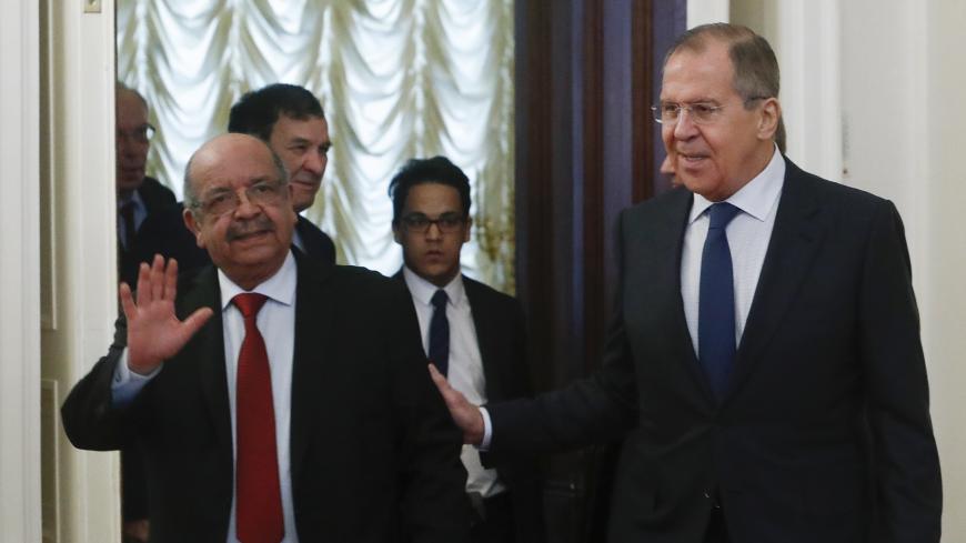 Russian Foreign Minister Sergei Lavrov and his Algerian counterpart Abdelkader Messahel enter a hall during a meeting in Moscow, Russia February 19, 2018. REUTERS/Sergei Karpukhin - UP1EE2J0R78HE