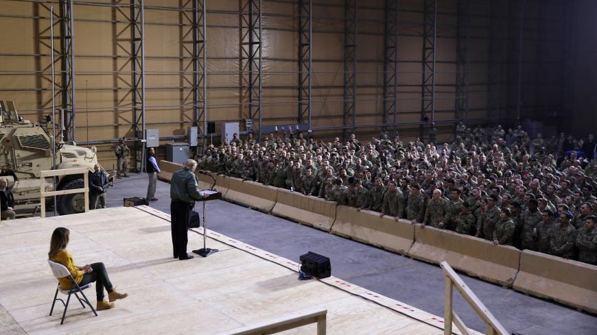 U.S. President Donald Trump delivers remarks to U.S. troops in an unannounced visit to Al Asad Air Base, Iraq December 26, 2018. REUTERS/Jonathan Ernst - RC1801320710