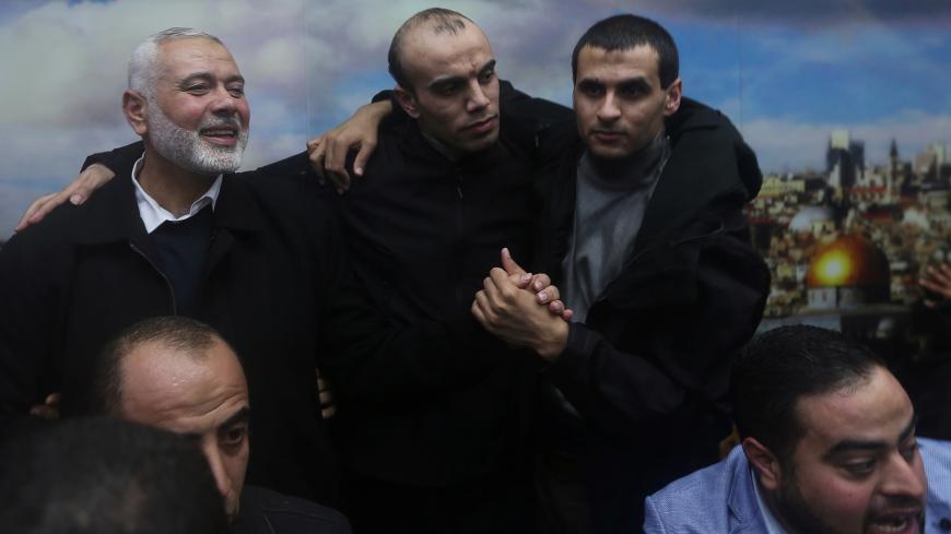 Palestinian Hamas Chief Ismail Haniyeh welcomes Hamas members who went missing in Egypt a few years ago, after their arrival in Gaza City February 28, 2019. REUTERS/Ibraheem Abu Mustafa - RC1C19571390