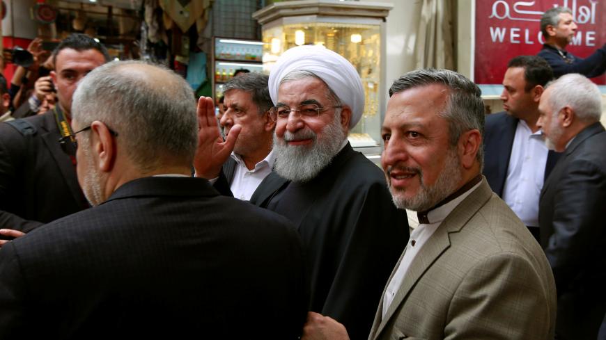 Iranian President Hassan Rouhani waves after meeting Grand Ayatollah Ali al-Sistani in Najaf, Iraq, March 13, 2019 . REUTERS/Alaa Al-Marjani - RC1B33559E30