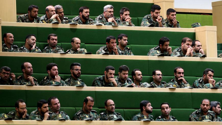 Members of the Iranian Revolutionary Guard listen to a speech in parliament in Tehran on October 7, 2018, over the a bill to counter terrorist financing. - The bill, one of four put forward by the government to meet demands set by the international Financial Action Task Force (FATF), was passed by 143 votes to 120, according to the semi-official ISNA news agency. (Photo by ATTA KENARE / AFP)        (Photo credit should read ATTA KENARE/AFP/Getty Images)