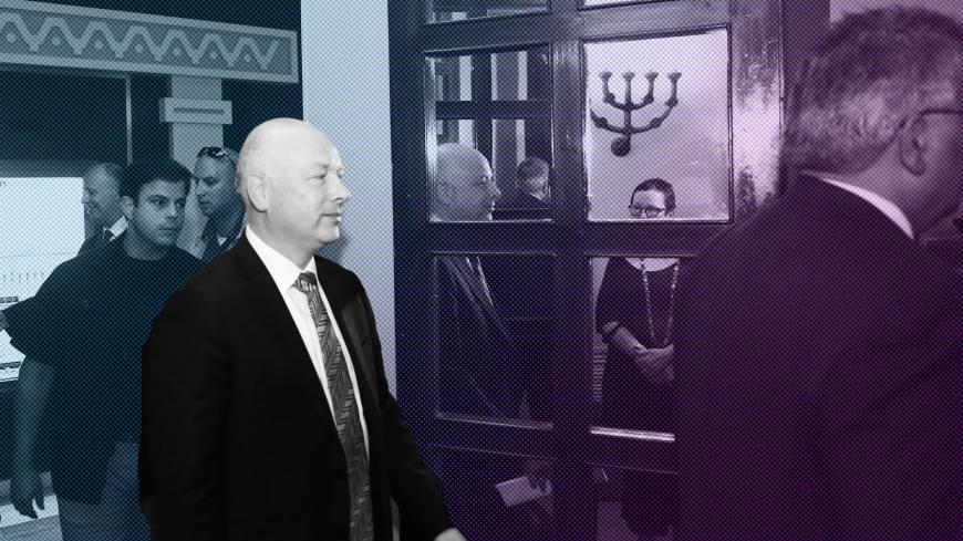 Jason Greenblatt (C), US President Donald Trump's Middle East envoy, is reflected in a mirror as he enters a room to hold a news conference with Israeli Minister of Regional Cooperation and the head of the Palestinian Water Authority, in Jerusalem on July 13, 2017. / AFP PHOTO / POOL / RONEN ZVULUN        (Photo credit should read RONEN ZVULUN/AFP/Getty Images)