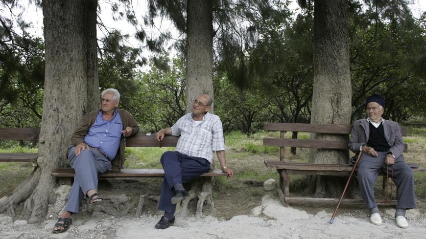 Men rest in Vakifli village, which is located in Hatay province, June 13, 2007. In sleepy Vakifli, Turkey's last surviving ethnic Armenian village, perched high among orange groves overlooking the east Mediterranean, elderly farmers say they will probably vote for the Islamist-rooted AK Party in July 22 elections. Picture taken June 13, 2006. To match feature TURKEY-ELECTION/CHRISTIANS   REUTERS/Umit Bektas (TURKEY) - GM1DVNFQSPAA