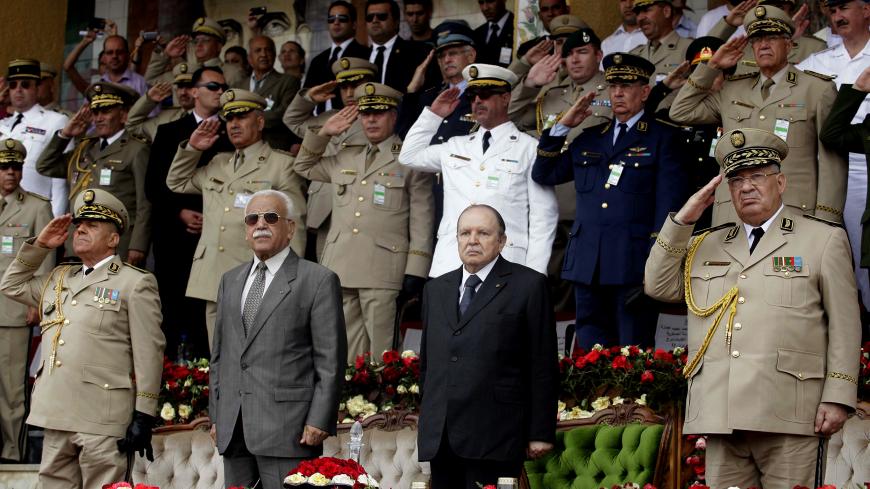 Algeria's President and head of the Armed Forces Abdelaziz Bouteflika (2nd R), Army Chief of Staff General Ahmed Gaid Salah(R) and Abdelmalek Guenaizia (2nd L), Minister Delegate to the Defence ministry attend a graduation ceremony of the 40th class of trainee army officers at a Military Academy in Cherchell 90 km west of Algiers June 27 ,2012.REUTERS/Ramzi Boudina(ALGERIA - Tags: POLITICS MILITARY) - GM1E86S088701