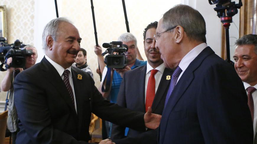 General Khalifa Haftar (L), commander in the Libyan National Army (LNA), shakes hands with Russian Foreign Minister Sergei Lavrov during a meeting in Moscow, Russia August 14, 2017. REUTERS/Sergei Karpukhin - UP1ED8E0PWK6C