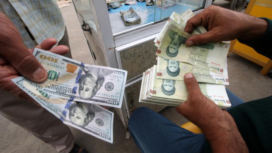 Iranian rials, U.S. dollars and Iraqi dinars are seen at a currency exchange shop in Basra, Iraq November 3, 2018. Picture taken November 3, 2018. REUTERS/Essam al-Sudani - RC18BD110300