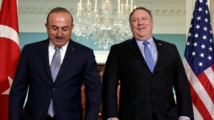 U.S. Secretary of State Mike Pompeo (R) and Turkey's Foreign Minister Mevlut Cavusoglu face reporters before their meeting at the State Department in Washington, U.S., November 20, 2018. REUTERS/Yuri Gripas - RC17E36FD880