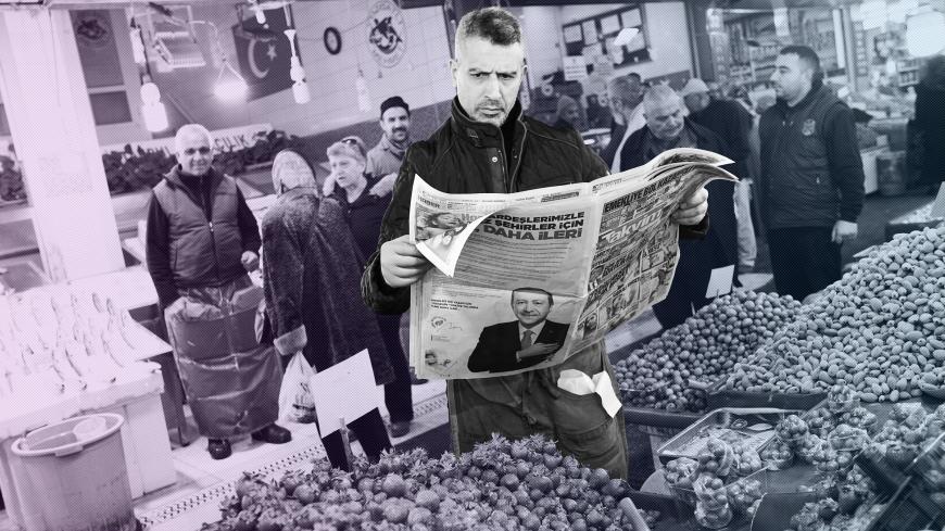 A stallholder reads a newspaper as he waits for customers at a bazaar in Ankara, Turkey, March 26, 2019. Picture taken March 26, 2019. REUTERS/Umit Bektas - RC14A18DA6D0