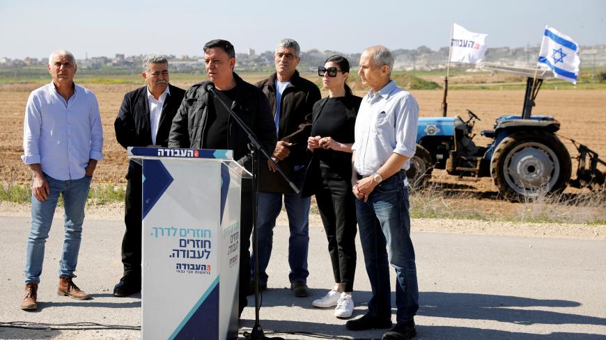 Avi Gabbay, leader of the Labour party speaks as his party candidates stand behind him during an election campaign event in Kibbutz Nahal Oz, near the Gaza Strip border, in southern Israel March 7, 2019. Picture taken March 7, 2019. REUTERS/Amir Cohen - RC15F4569300